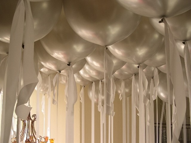 Balloons On The Ceiling With Ribbons Hanging At White Cloth Gallery